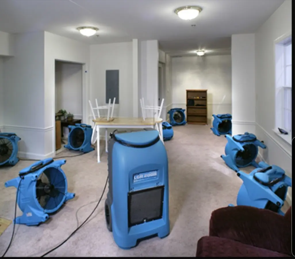 Air movers and dehumidifier setup for Water Damage Restoration in Booneville